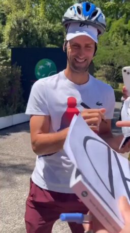 After accidentally being struck in the head by a metal water bottle yesterday while signing post-match autographs, Djokovic went out again today with a helmet